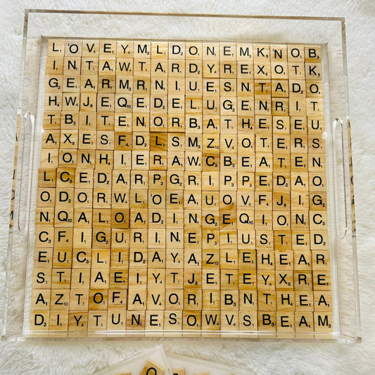 Wooden Scrabble letter tiles with scrabble-style design and hidden words in acrylic tray filled with epoxy resin.